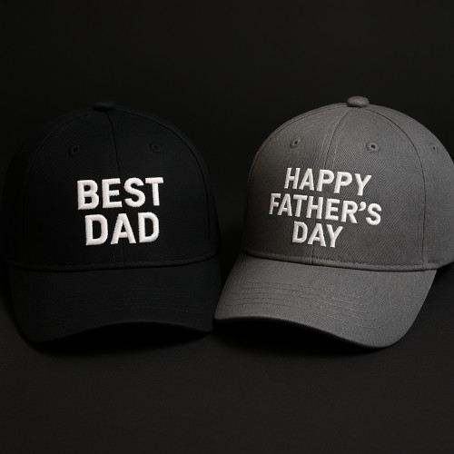 Two custom embroidered baseball caps for Father’s Day, one black with “BEST DAD” and one gray with “HAPPY FATHER’S DAY” stitched in white.