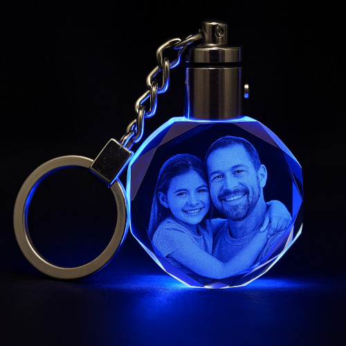 Personalized LED crystal keychain featuring father and daughter, engraved and glowing blue.