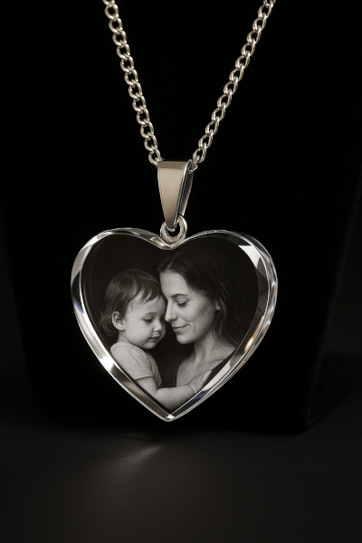 Heart-shaped personalized crystal photo necklace with silver chain, engraved with a touching parent-child image.